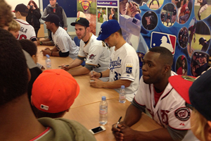 The MLB players sign autographs for the kids at the EBLT clinics