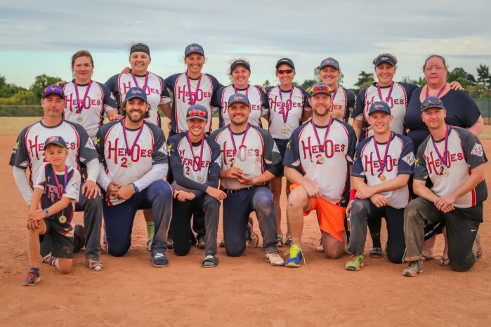 Team photo of H2O slowpitch softball team with 2022 NSL1 trophy and medals